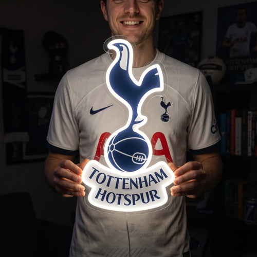 Fan holding a glowing Tottenham Hotspur FC LED Neon Sign showcasing realistic brightness and size