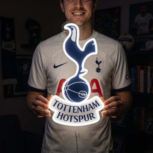 Fan holding a glowing Tottenham Hotspur FC LED Neon Sign showcasing realistic brightness and size