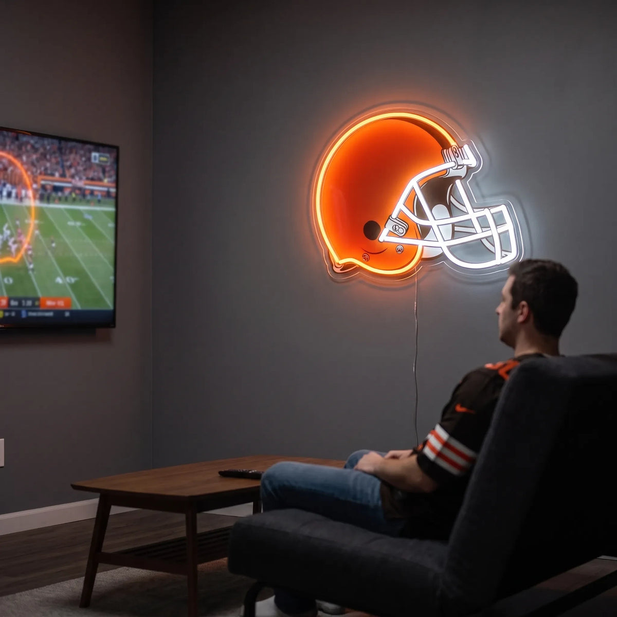 A man holding a large Cleveland Browns NFL football team helmet LED neon sign