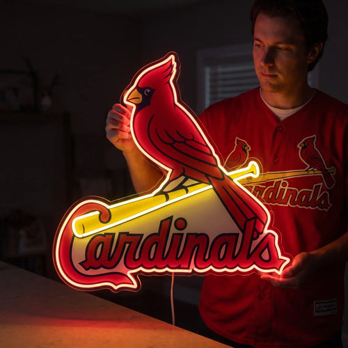 A man holding a large St. Louis Cardinals MLB baseball team logo LED neon sign