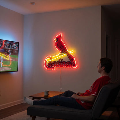 A man holding a large St. Louis Cardinals MLB baseball team logo LED neon sign